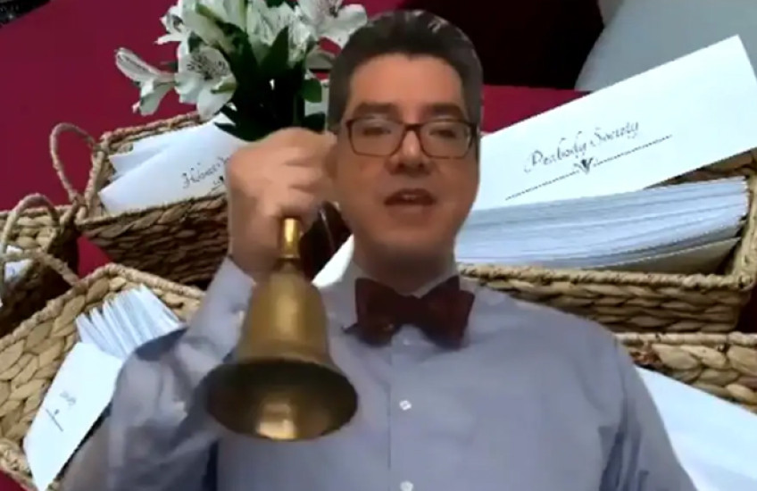 screengrab of dean saldana ringing bell from video