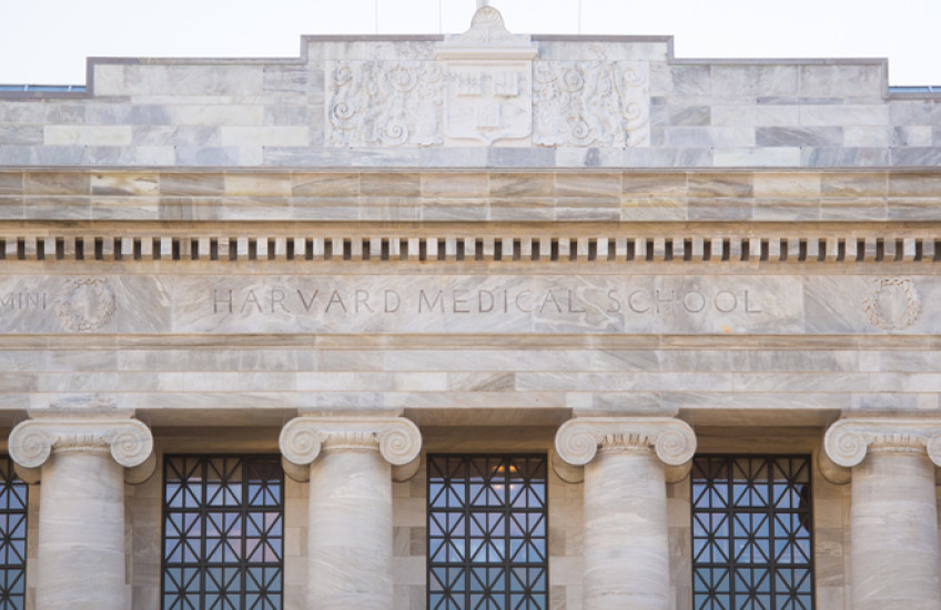 Facade of Gordon Hall chiseled with Harvard Medical School