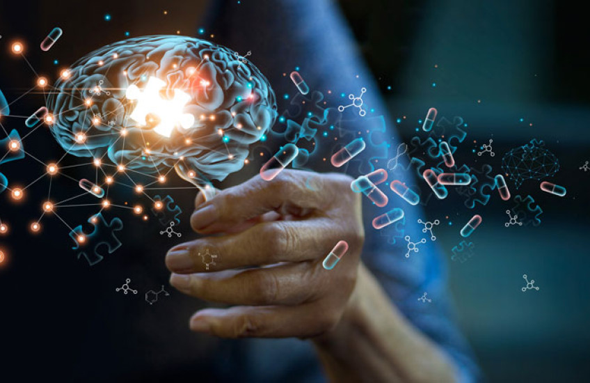 Illustration of an older person's hand holding a holographic image of a brain with an illuminated puzzle piece inside it