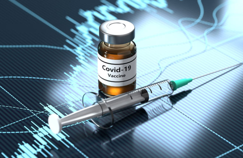 Photo illustration of a syringe and a bottle marked "COVID vaccine" 