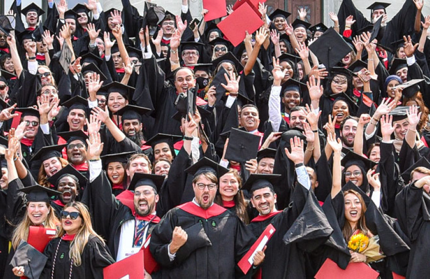 Graduates gathered for a celebratory photo after receiving their diplomas