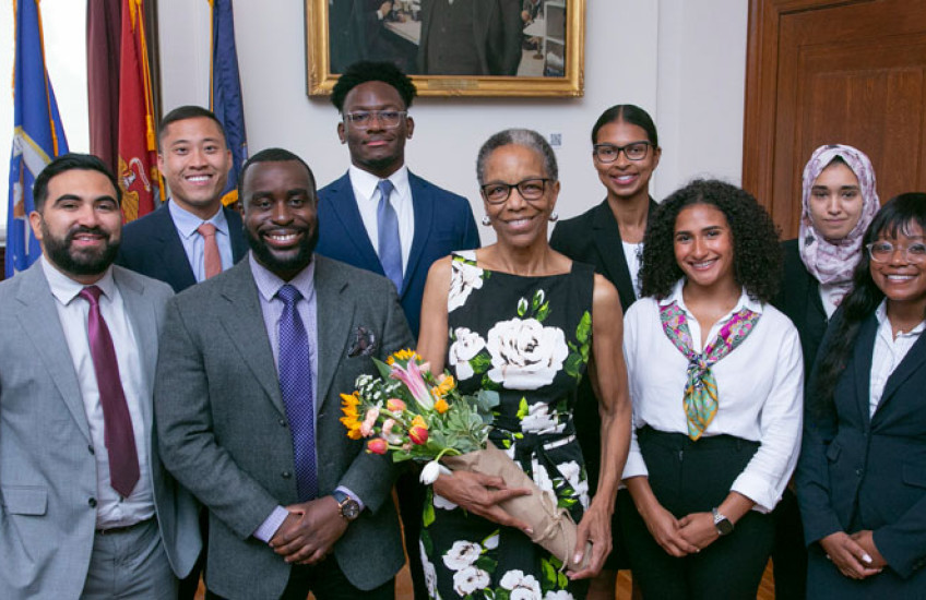 Dr. Joan Reede surrounded by 2023 participants of the Visiting Research Internship program. 