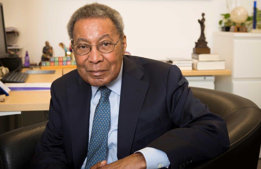 Photo of Dr. Alvin Poussaint in his HMS office 