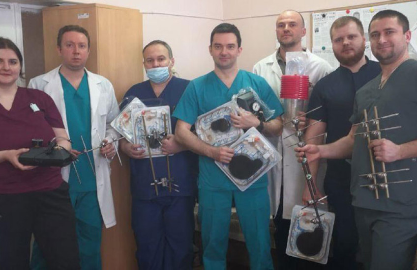 Image of physicians and health care providers in Dnipro Children's Hospital, Ukraine, holding wound pumps and other medical equipment