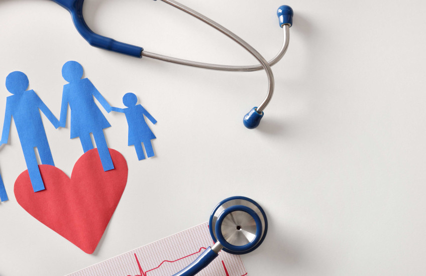 Image of stethoscope and family paper dolls