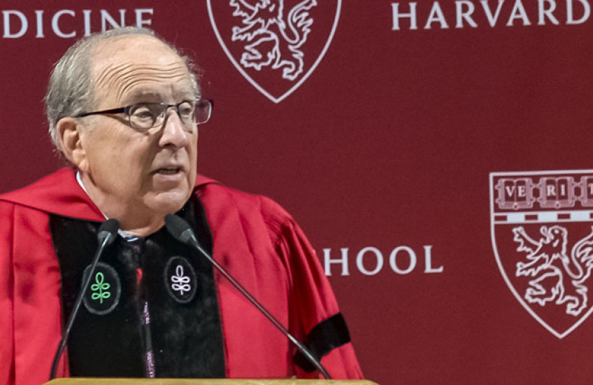 Dean Donoff for Harvard School of Dental Medicine in front of microphone