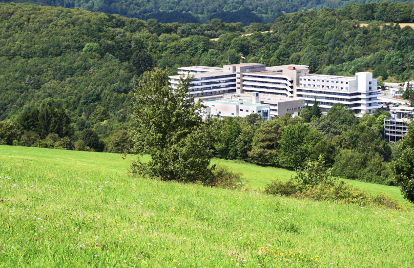 Photo of hospital building in a rural setting in the mountains