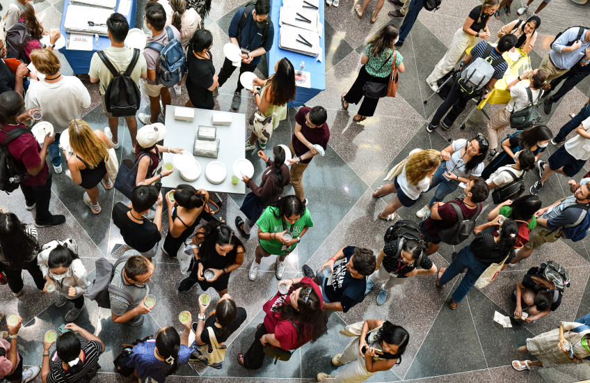 Overhead photograph of new medical and dental students at a gathering in one of the HMS Quad buildings