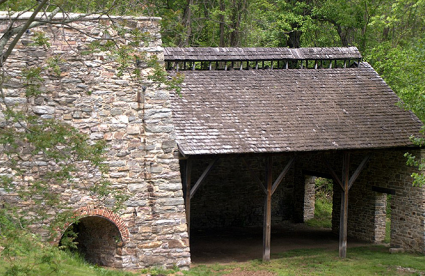 An unoccupied stone building in the woods