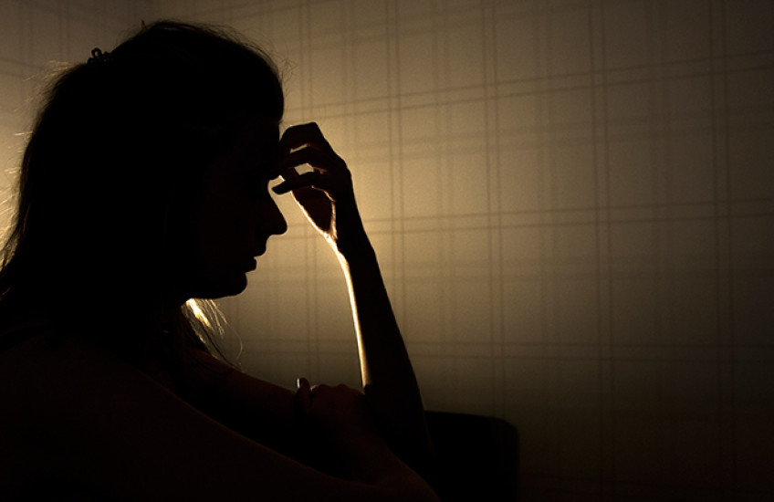 silhouette of stressed young woman