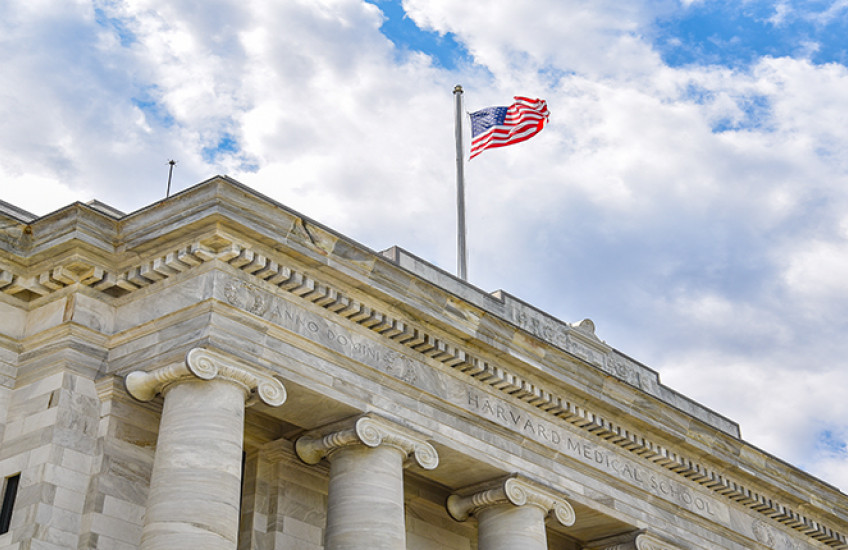 American flag flying above Gordon Hall on the HMS Quad. Image: Steve Lipofsky