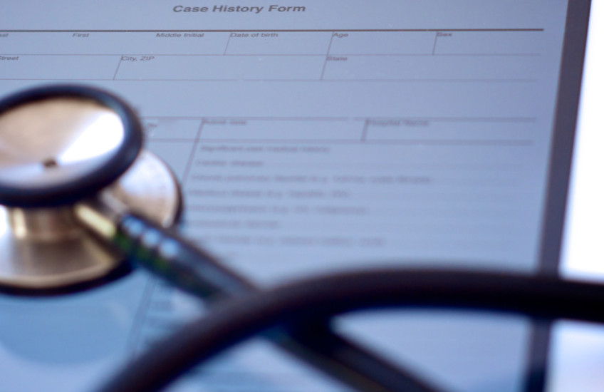 A stethoscope on a case history form