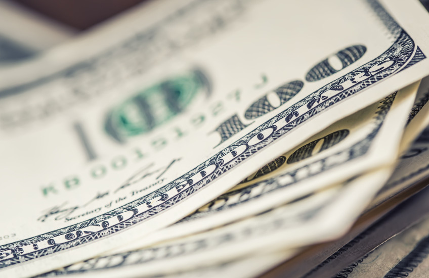 A stack of hundred dollar bills.