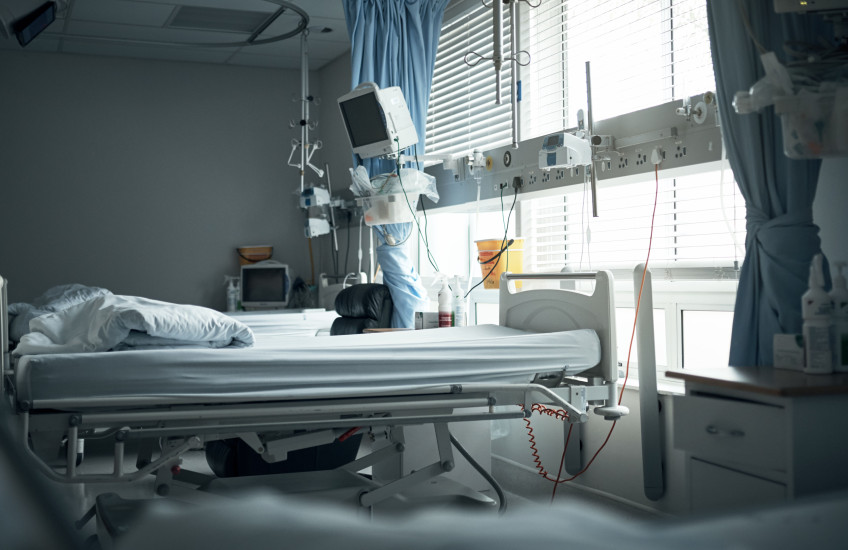 An empty hospital bed.