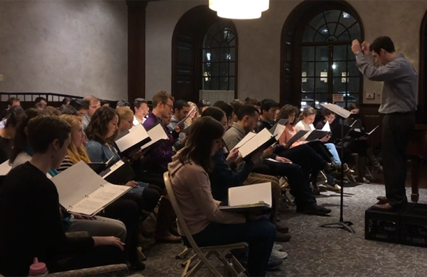 chorus rehearsing in Vanderbilt Hall