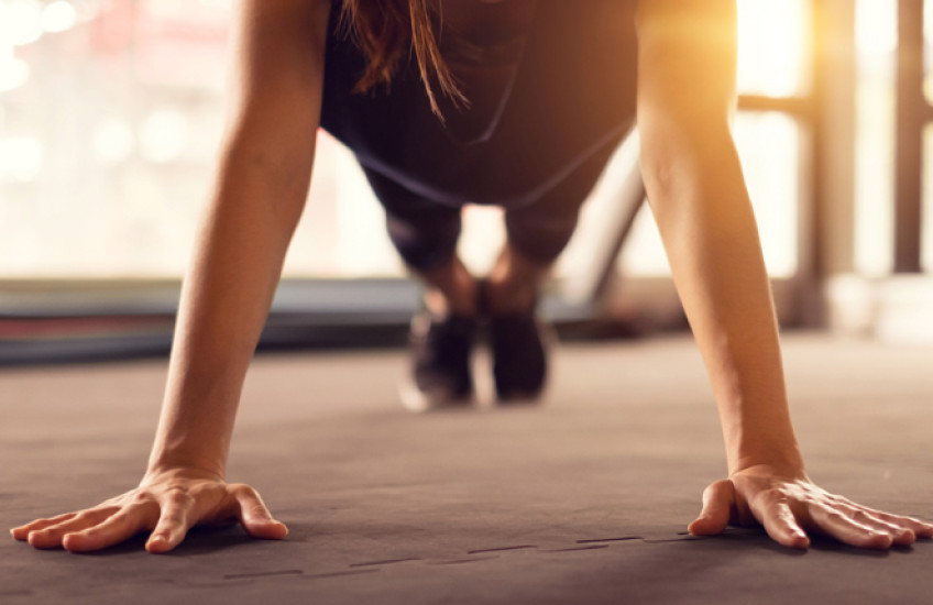 An athlete holding a plank position.