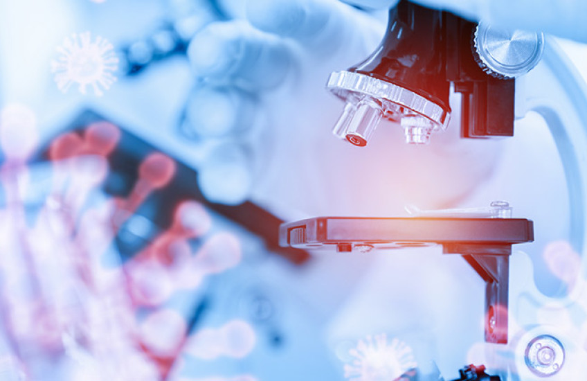 digital collage of coronavirus, microscope, and gloved hand