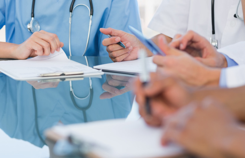 Generic photo of health care workers holding clipboards 