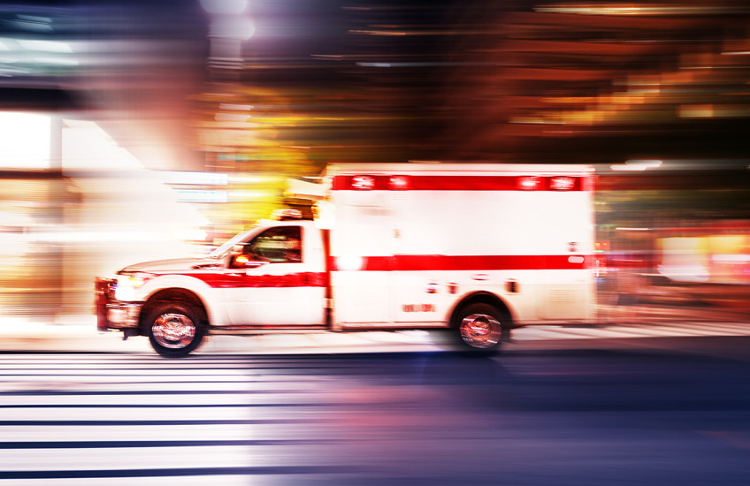 Ambulance speeding at night with motion blur