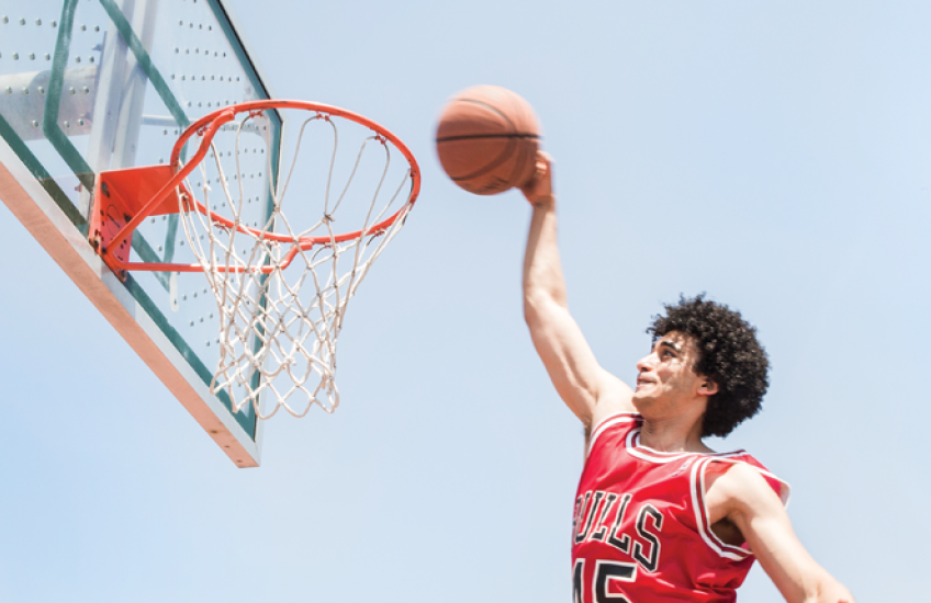 Photo of Amen dunking a basketball