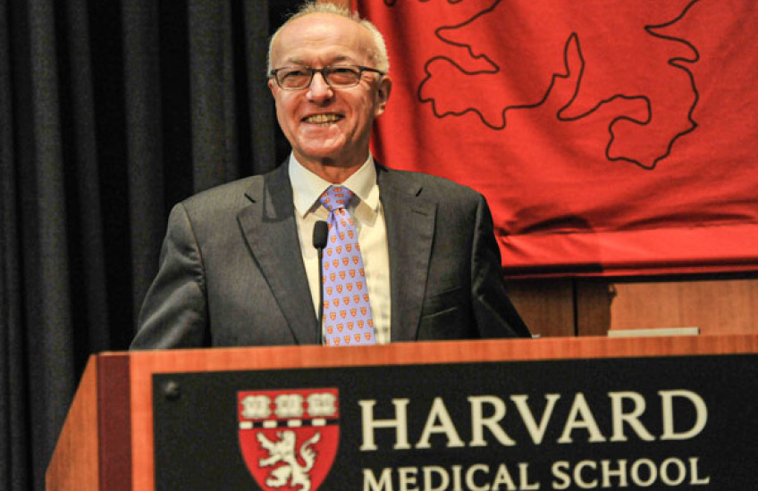 Dean Daley speaking at podium during State of School address 