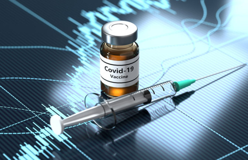 Photo illustration of a syringe and a bottle marked "COVID vaccine" 