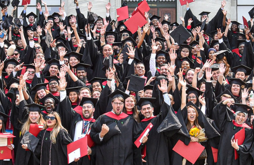 Graduates gathered for a celebratory photo after receiving their diplomas