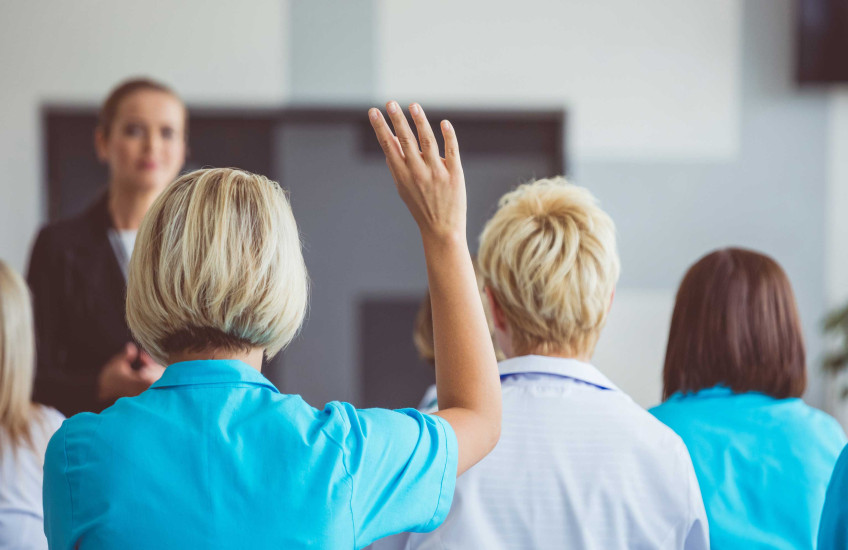 Health care workers in a classroom 