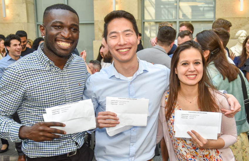 3 HMS students together holding their Match letters 