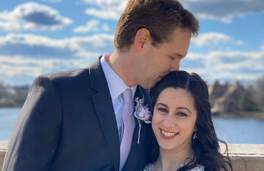 Portrait photo of Ovsak & Fallah in wedding apparel
