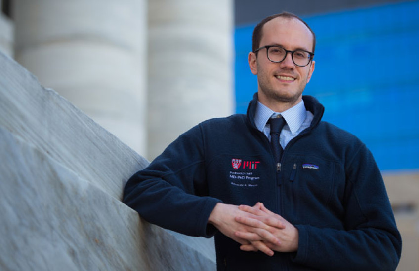 Image of Maury standing on the steps outside Gordon Hall 