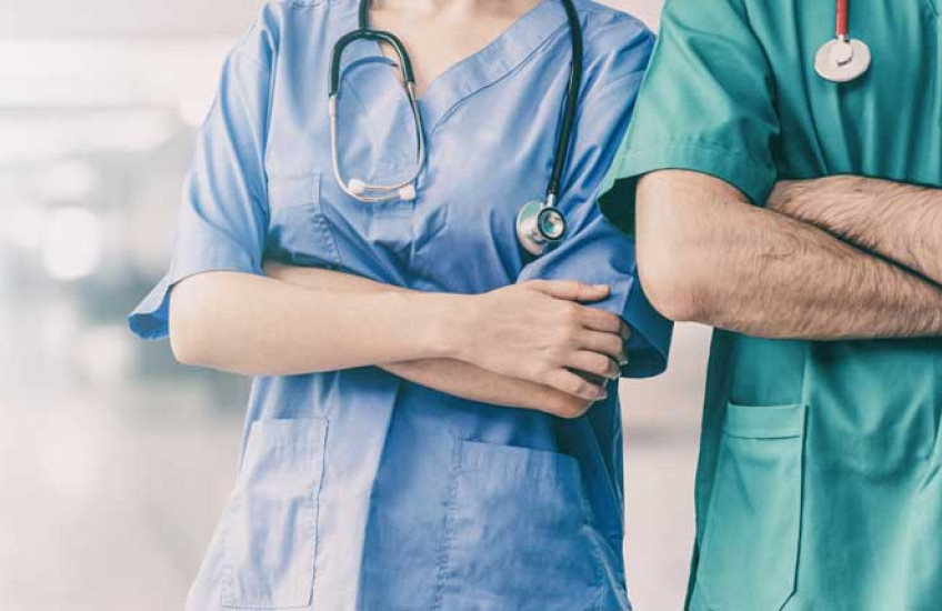 Stock photo of nurses in scrubs, no faces shown