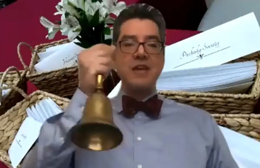 screengrab of dean saldana ringing bell from video