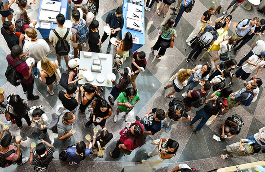 Overhead photograph of new medical and dental students at a gathering in one of the HMS Quad buildings