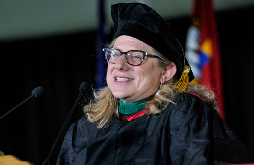 Closeup of Brendel in regalia at podium
