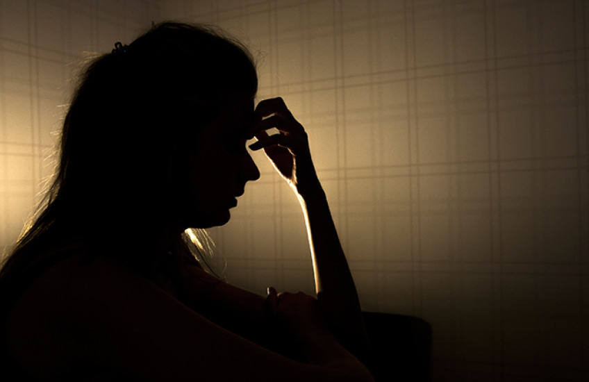silhouette of stressed young woman