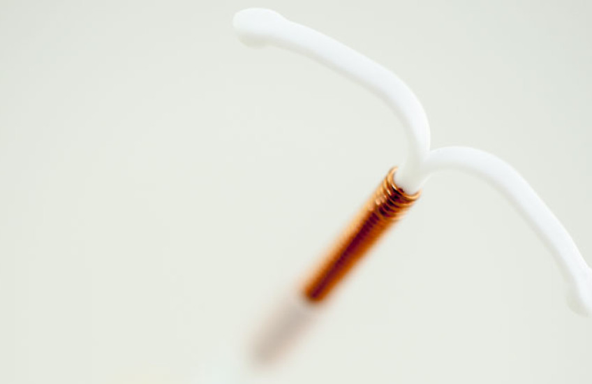 Abstracted close-up of an IUD.