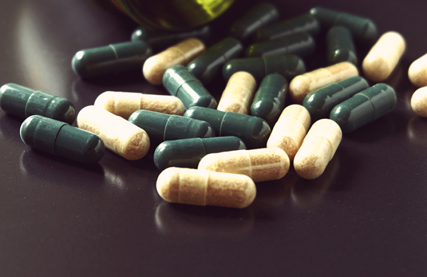 bottle with pills spilling out