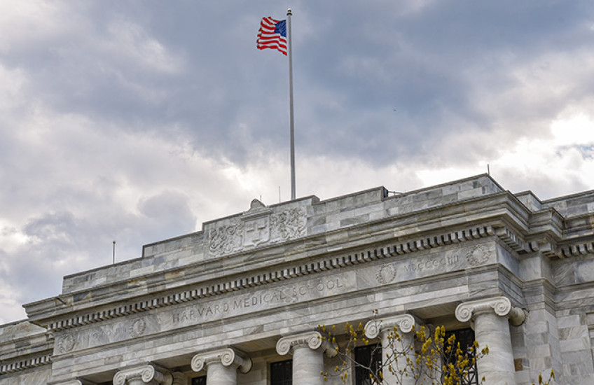 Facade of Gordon Hall with American flag flying