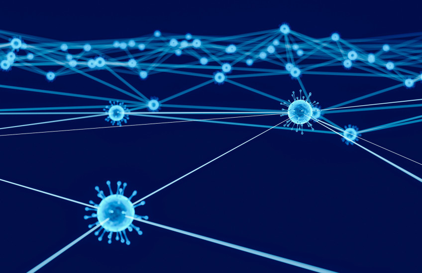 stylized SARS-CoV-2 particles sending out connections to many others bright blue on dark blue background