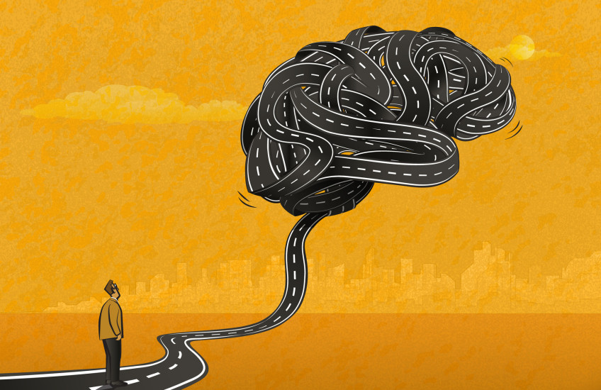 Illustration of a man standing looking at a brain balloon made of tangled black tape that looks like a road, on a gold background