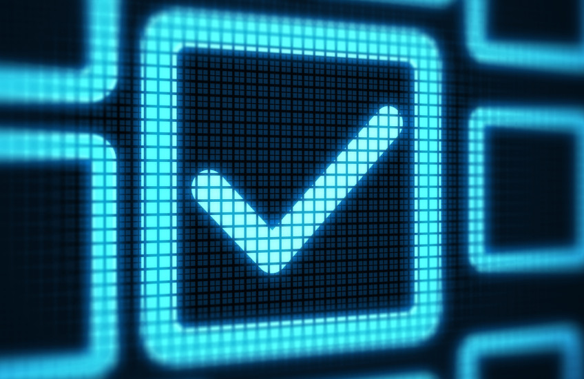 Big blue checkmark against a black background