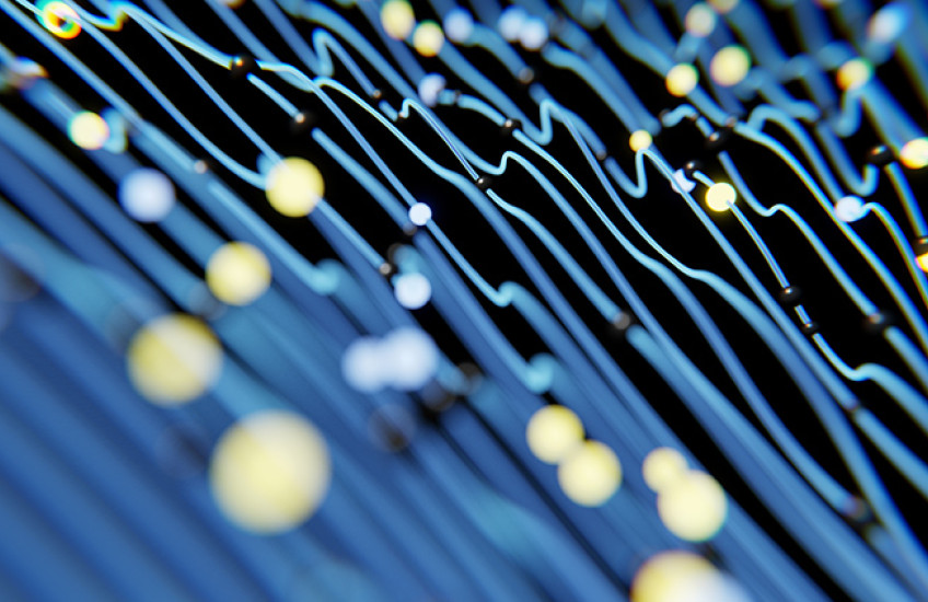 Stylized image of neural connections (blue background, yellow connections) in the brain