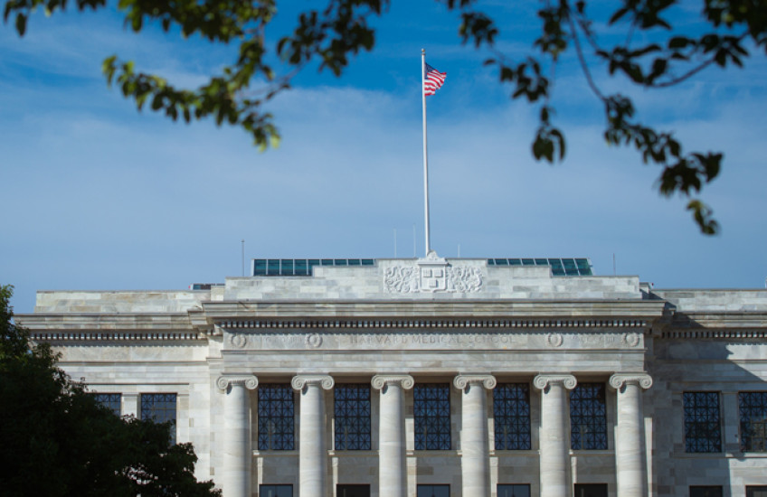 photo of gordon hall facade with flag flying