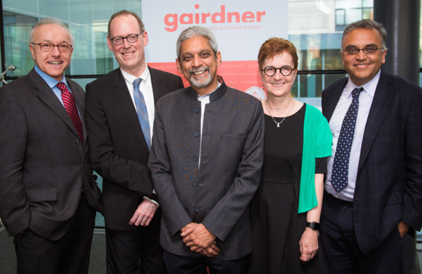 George Daley, Dean of Harvard Medical School, Paul Farmer, head of the HMS department of global health and social medicine, Gairdner Global Health Award winner Vikram Patel, Janet Rossant, president of the Gairdner Foundation and Ashish Jha, faculty director of the Harvard Global Health Initiative celebrate Patel's groundbreaking research in global mental health. 