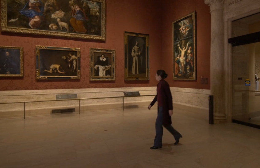 A woman walking in the Museum of Fine Arts