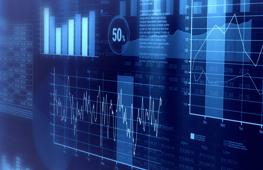 Graphs and charts overlapping onscreen in a digital collage