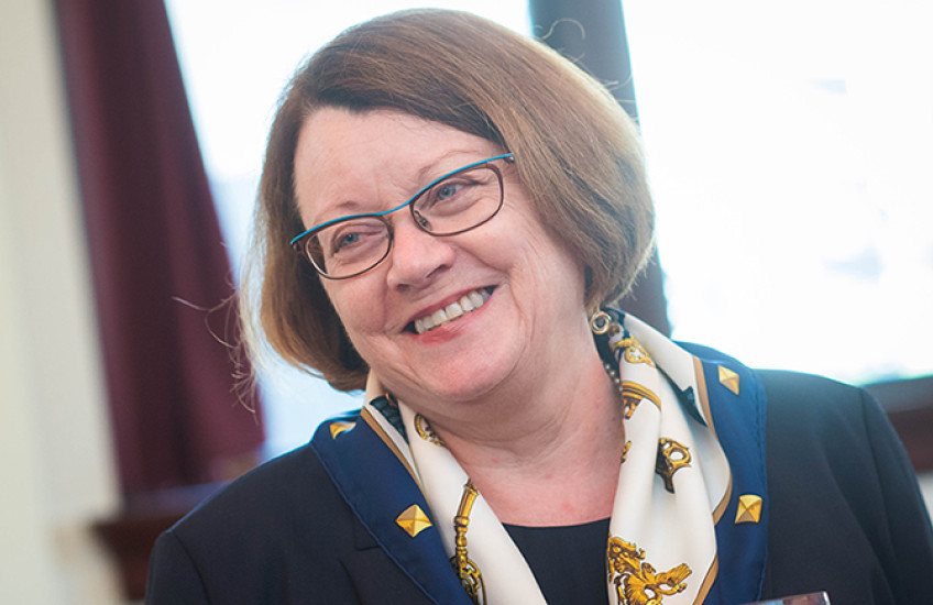 woman with brown hair smiling