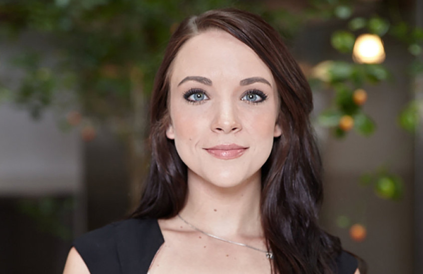 Head shot of young woman with brown hair