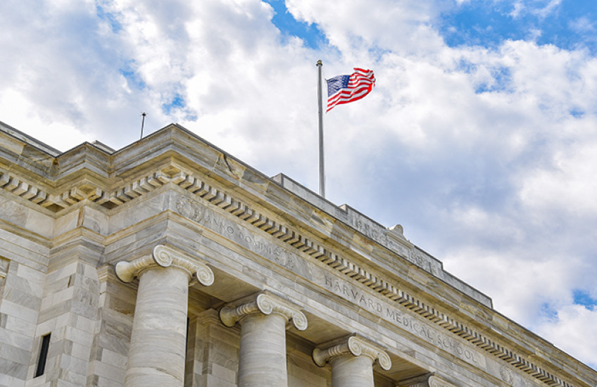 American flag flying above Gordon Hall on the HMS Quad. Image: Steve Lipofsky
